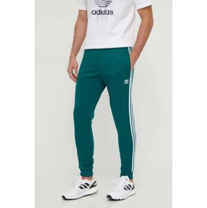 Tepláky adidas Originals zelená farba, s nášivkou