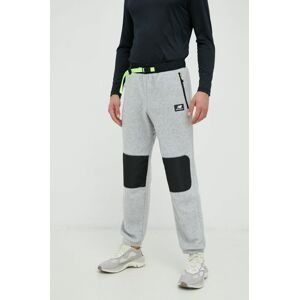 Nohavice New Balance pánske, šedá farba, s nášivkou