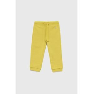 Detské bavlnené nohavice United Colors of Benetton žltá farba, jednofarebné